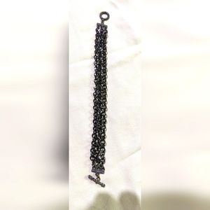Ladies bracelet. Black 3 stranded. Looks iridescent